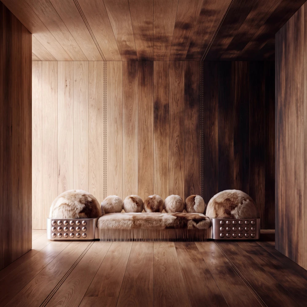 Moonage sofa by Diamant Versatile displayed in a wood-panelled interior, with tonal fur upholstery, rounded cushions and sculptural metallic sides.